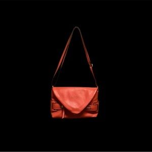 NICOLE MILLER ORANGE V-SHAPED FLAP CROSSBODY PURSE USED